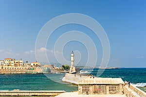 Entrance to the town of Chania by waterway with a lighthouse. Crete, Greece, Europe