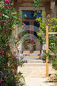 Entrance to a traditional Dalmatian house with beautiful oleander garden