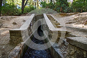 Entrance to tunnel on Loutanis river in Seven spring Epta Piges in forest near Kolymbia Rhodes, Greece