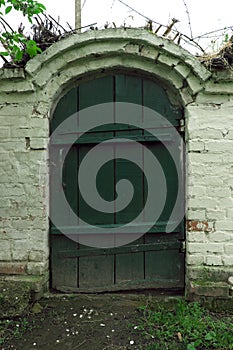 Entrance to the village cellar. The old green door