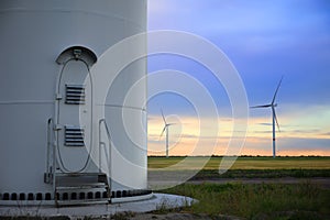 Entrance to wind turbine power generator in evening. Alternative energy source