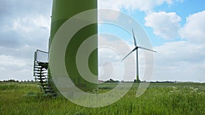 Entrance to a Wind Turbines in foreground and another Wind Turbine on a field in background in East Frisia on a windy