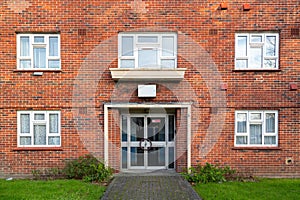 The entrance of a typical British brick block of flats