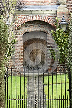 Entrance wooden door and metal gate of a traditional English man