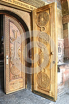 Entrance wooden doors with cross at Church
