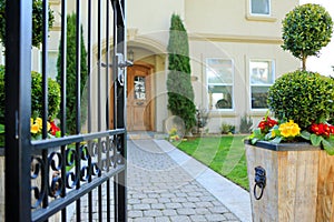 Entrance wrought iron gate to luxury house