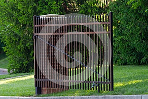 Entrance wrought iron gate to luxury house black metal