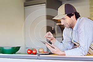 Entrepeneur using his phone in his takeaway food stall photo