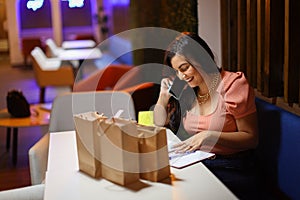 Entrepeneur Woman Coordinading Shipping and Delivery Smiling