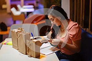 Entrepeneur Woman Writing Down Notes for Business