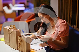 Entrepeneur Woman Writing Down Notes for Business