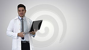 Entrepreneur engineer or doctor with a laptop laughing on gradient background.
