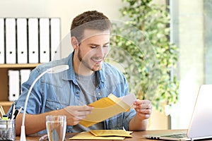 Entrepreneur opening a padded envelope