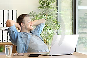 Entrepreneur relaxing and thinking at office