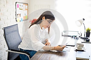 Entrepreneur reviewing few contract papers in office