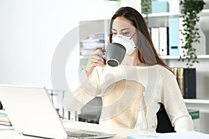 Entrepreneur wearing mask with spilled coffee over shirt