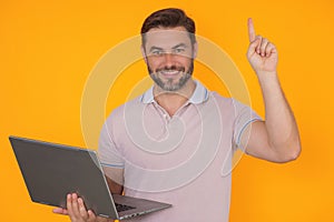 Entrepreneur working with a laptop. Business man man using laptop computer on studio background. Thoughtful caucasian