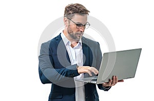 Entrepreneur working with a laptop. Business man man using laptop computer on studio background. Thoughtful caucasian