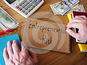 Entrepreneurial Risk is shown on the conceptual business photo