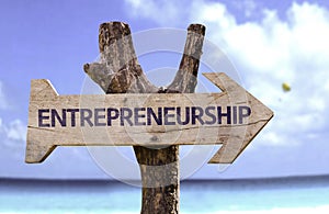 Entrepreneurship wooden sign with beach background