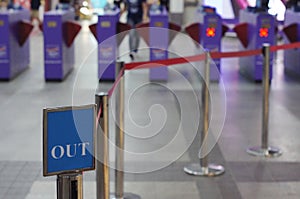 Entry / Exit sign against Rope Barrier Stanchion Queue Rope Barrier Posts Stands Crowd Control