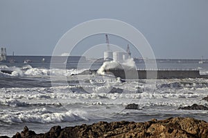 Entry of Leixoes harbor in a rough sea day photo