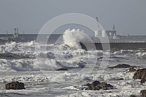 Entry of Leixoes harbor in a rough sea day photo