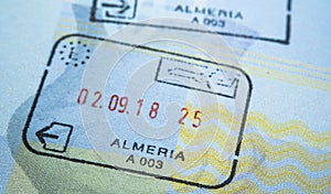 Entry stamp in passport made by immigration officer at border and visa control at Almeira airport in Spain. Selective focus. Macro