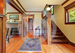 Entryway with wooden staircase and hardwood floor