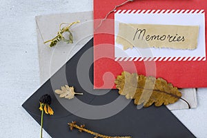 Envelope and autumn dried plants and flowers, memories word on the paper