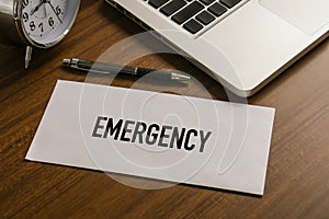 Envelope with EMERGENCY fund word for saving emergency money.Saving for emergency concept.DCA