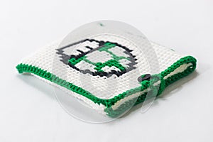 envelope for external hard drive, crocheted with a green mushroom drawn