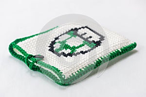 envelope for external hard drive, crocheted with a green mushroom drawn