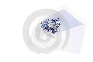 Envelope with forget-me-not flowers in a heart shape, love lett