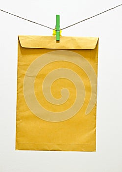 Envelope and green clothespin