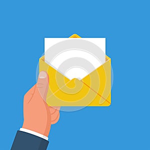 Envelope holding in the hand. Email message concept, sending