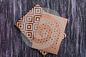 Envelope of Kraft paper. Love letter envelope. Wooden background. A holiday gift box. Gift with the letter.