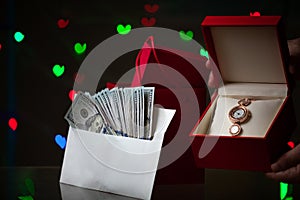 Envelope with money and gift boxes on background of hearts