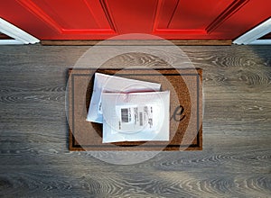 Envelope packages delivered to door step.