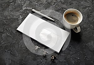 Envelope, pen and coffee cup