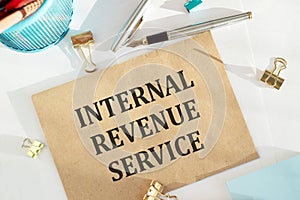 Envelope with text INTERNAL REVENUE SERVICE on a white background photo