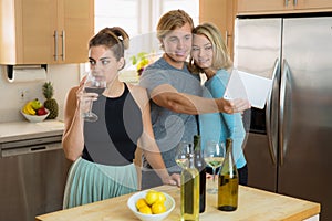 Envious single woman is bored by people at a party jealous about her friend and her date having fun