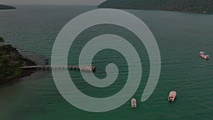 Environment of the boats and yachts nearly jetty in the sea with Island and mountain all around at Koh Kood Kood Island Trat Pro