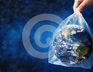 Environment concept with Earth planet globe held in plastic bag