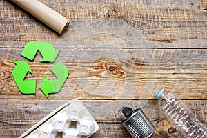 Environment concept with recycling symbol on rustic background top view mockup