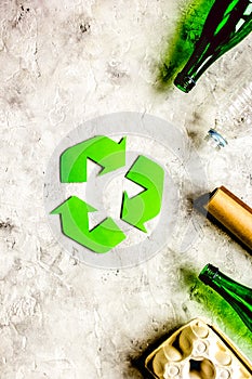 environment concept with recycling symbol on stone background top view mock-up