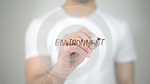 Environment, man writing on transparent screen