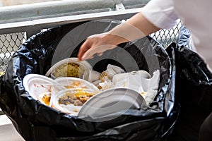 Environment unfriendly styrofoam plates and cups in plastic garb