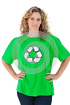 Environmental activist wearing green shirt with recycling symbol