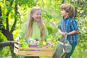 Environmental conservation concept. Cute toddler girl and boy working on farm outdoors. Childhood concept. Children